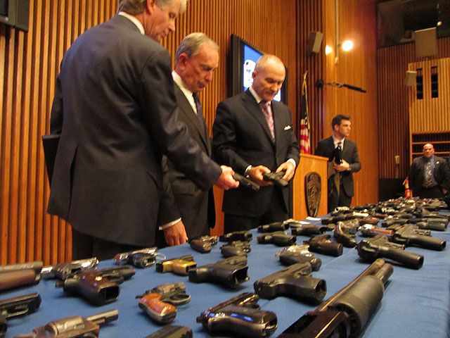 Vance, Bloomberg and Kelly look at the weapons  